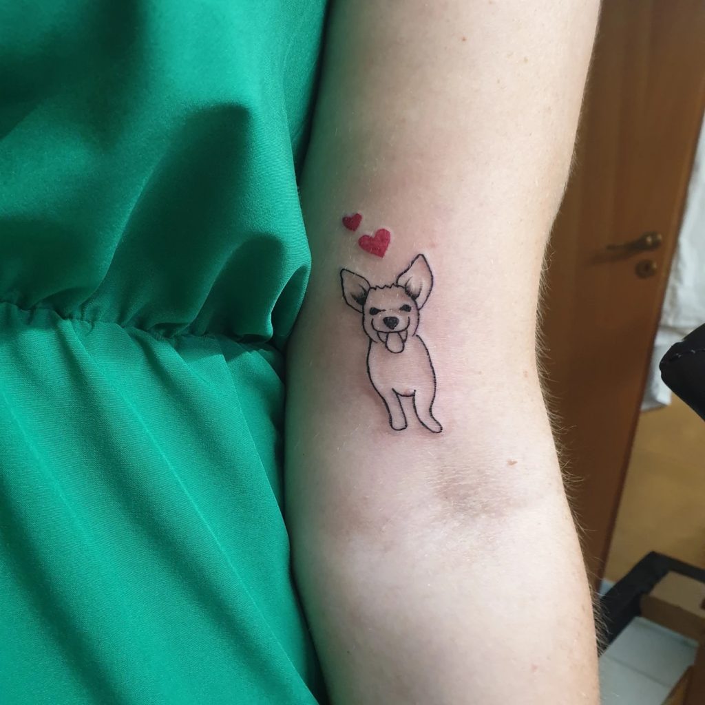 Tatuaggio di un dolcissimo cane posto sul braccio della padrona