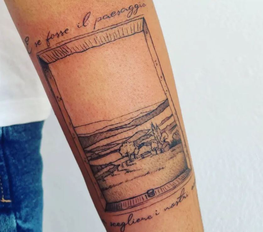 Tatuaggio paesaggistico sul braccio