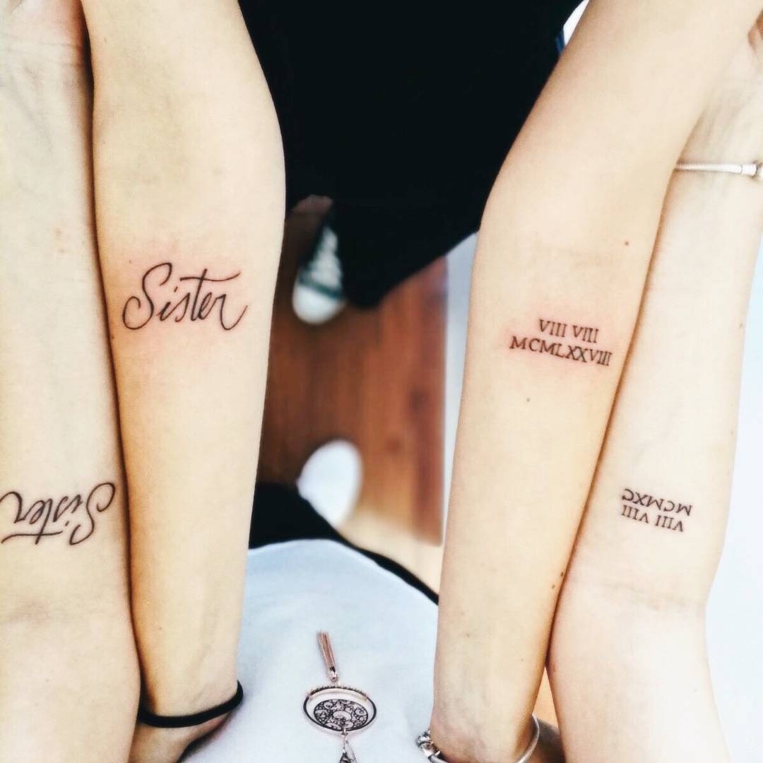 Numeri romani tatuaggio fatto da due sorelle